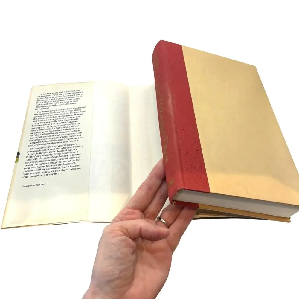 Two Garrison Keillor First Editions, Lake Wobegon Days, Leaving Home, HCDJ